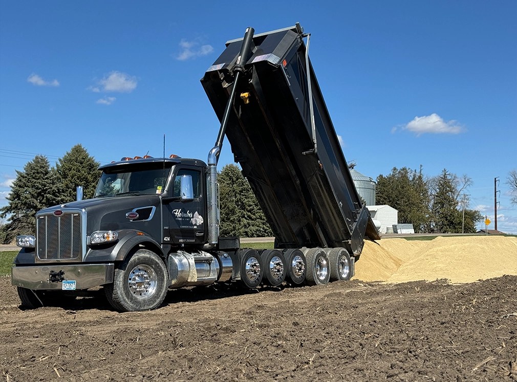 Dump truck unloading lime